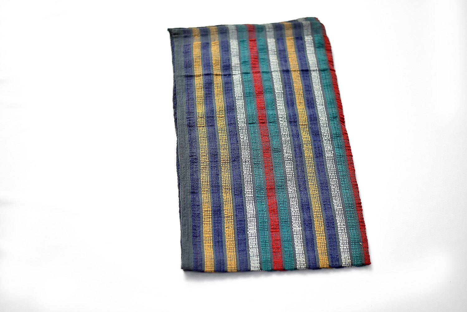 A striped kitchen towel detail